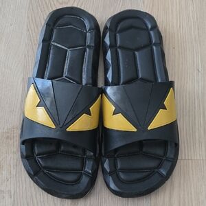 Black Slide Sandals with Yellow Accent Eyes